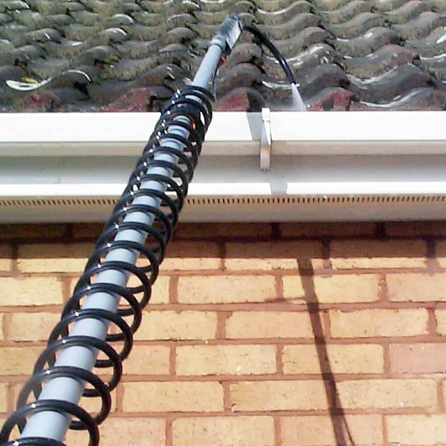 Gutter vacuum pole used for gutter cleaning in Swansea from the ground